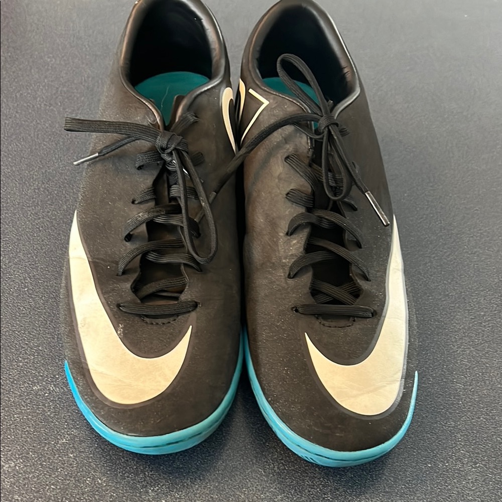 Nike Woman’s Black and Blue indoor Soccer Shoes